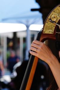 Cropped hand holding cello