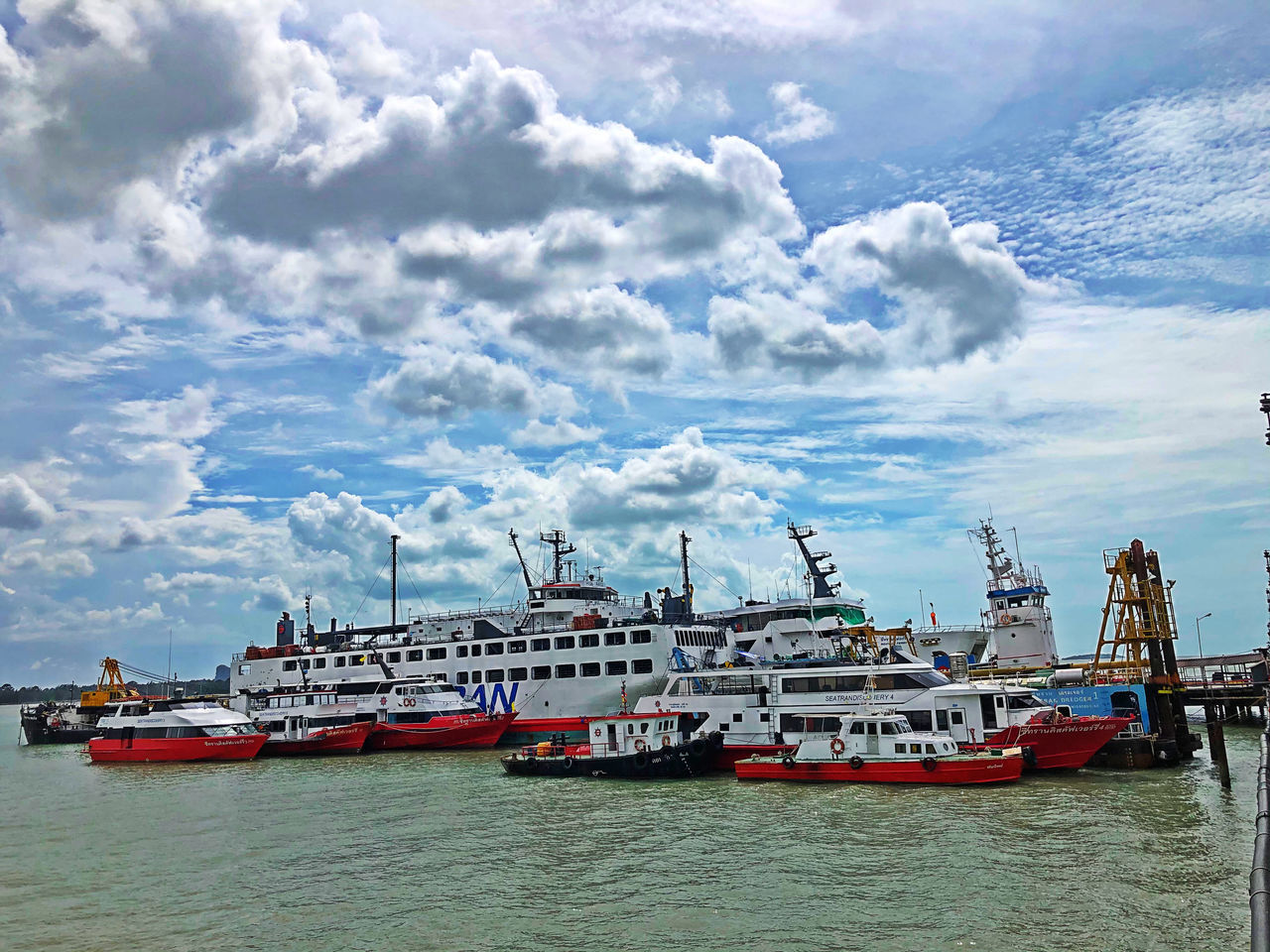 FISHING BOATS MOORED AT HARBOR