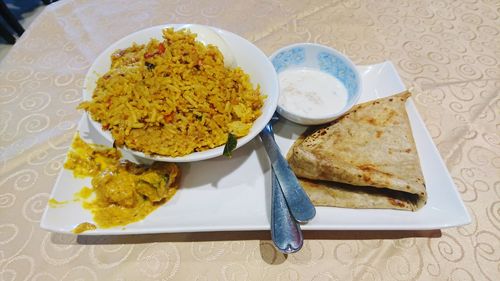 Close-up of food served on table