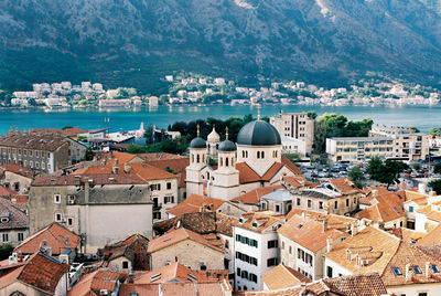 High angle view of townscape by sea