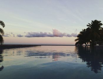 Scenic view of calm sea at sunset