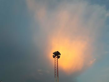 Low angle view of silhouette street light against sky during sunset