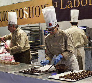 People working at market stall