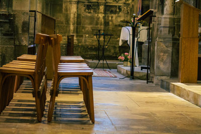 Empty chairs and tables in building