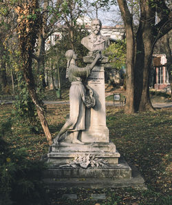 Statue of buddha against trees