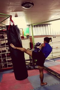 Side view of man with woman standing in corridor