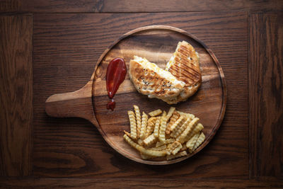 High angle view of bread on cutting board