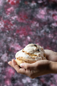 Close-up of hand holding ice cream