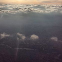 Aerial view of landscape against cloudy sky