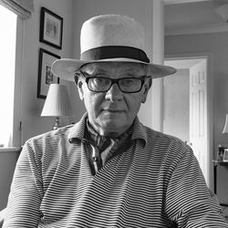 Portrait of senior man wearing hat at home