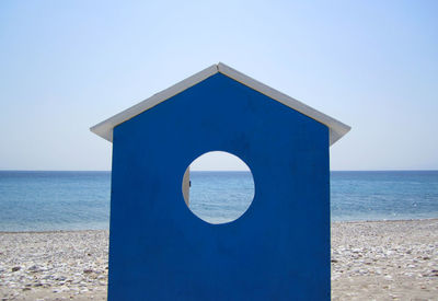 Beach hut with sea in background