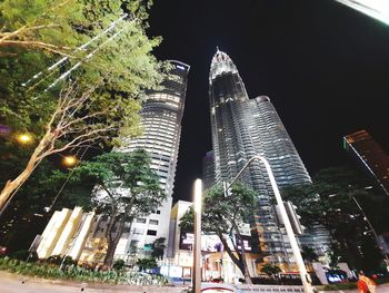 Low angle view of modern buildings at night