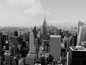 Aerial view of modern buildings in city against sky