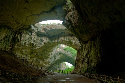 Scenic view of cave seen through tunnel