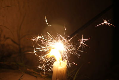 Close-up of illuminated firework display at night