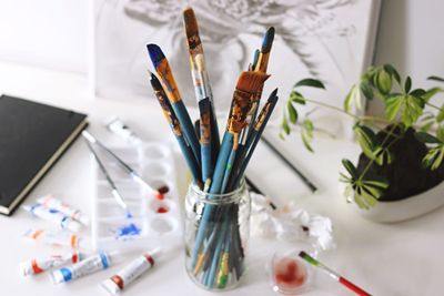 High angle view of paintbrushes on table