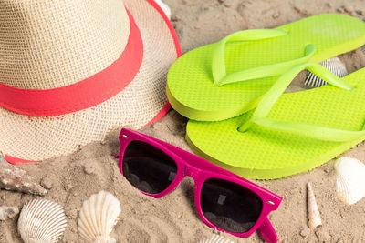 High angle view of sunglasses on beach