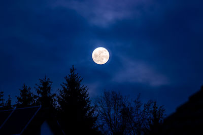 Low angle view of moon against sky at night