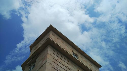 High section of building against cloudy sky