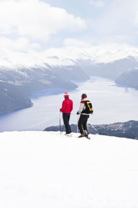 Mid adult couple skiing