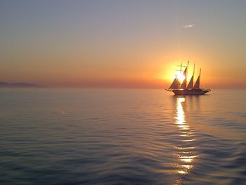 Silhouette of boat sailing in sea