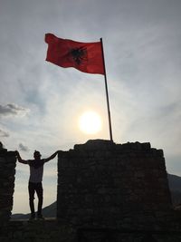 Full length of silhouette man standing against sky