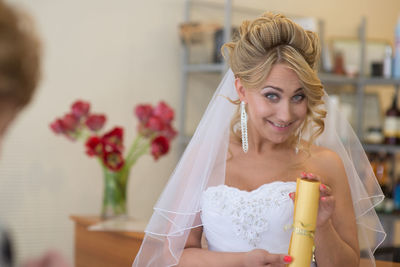 Portrait of beautiful bride at home