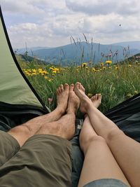 Low section of man relaxing on grass