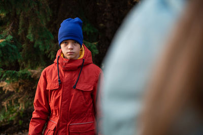 Portrait of boy standing in car