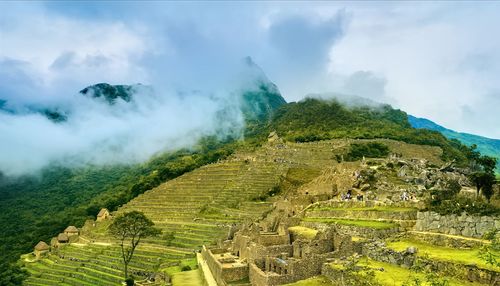 Panoramic view of green landscape against sky