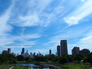 Modern buildings in city against sky