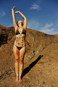 Young woman standing on beach