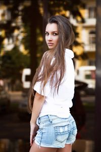 Portrait of beautiful woman standing outdoors