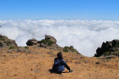 Rear view of man walking on mountain