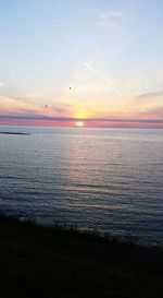 Scenic view of sea at sunset