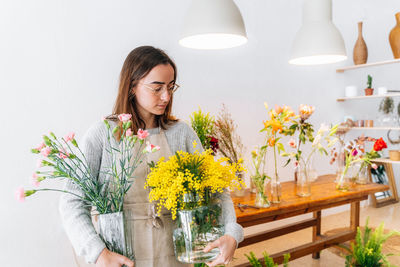 Young woman holding flower bouquet