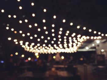 Close-up of illuminated christmas lights at night