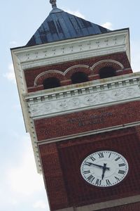 Low angle view of clock tower against sky