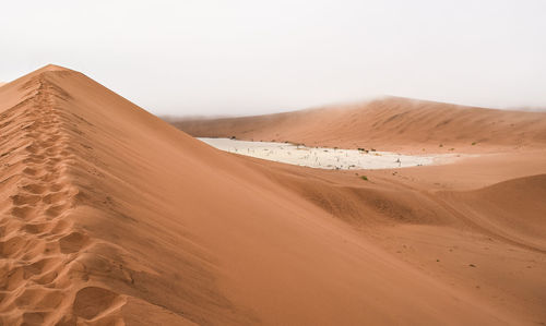 Scenic view of desert against sky