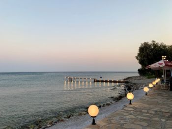 Scenic view of sea against clear sky during sunset