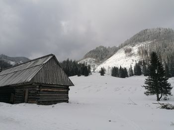 Scenic view of snow covered landscape against sky