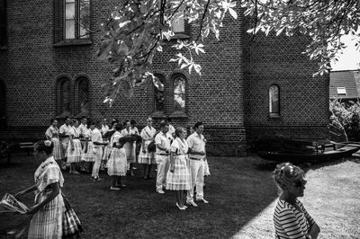 People standing in front of building