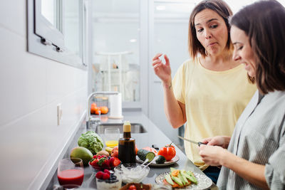 Women preparing food at kitchen