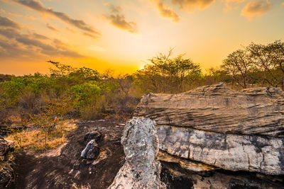 Scenic view of land against sky during sunset