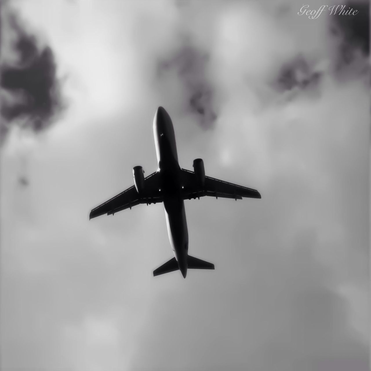 airplane, sky, low angle view, flying, travel, air vehicle, cloud - sky, mid-air, transportation, cloudy, outdoors, mode of transport, day, travel destinations, no people, cloud, tourism, weather, motion, dusk