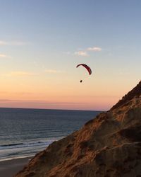 Hot air balloons flying over sea