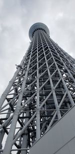 Low angle view of tower against cloudy sky