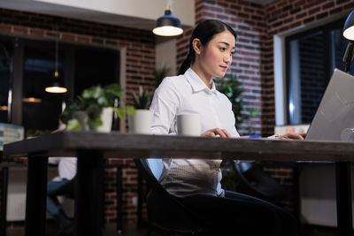 Portrait of businessman using digital tablet