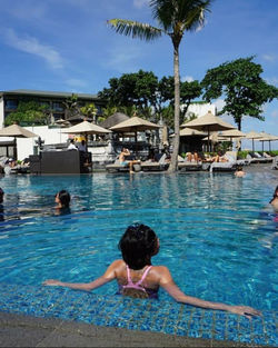 Rear view of women at swimming pool