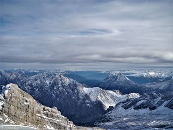 Scenic view of snowcapped mountains against sky